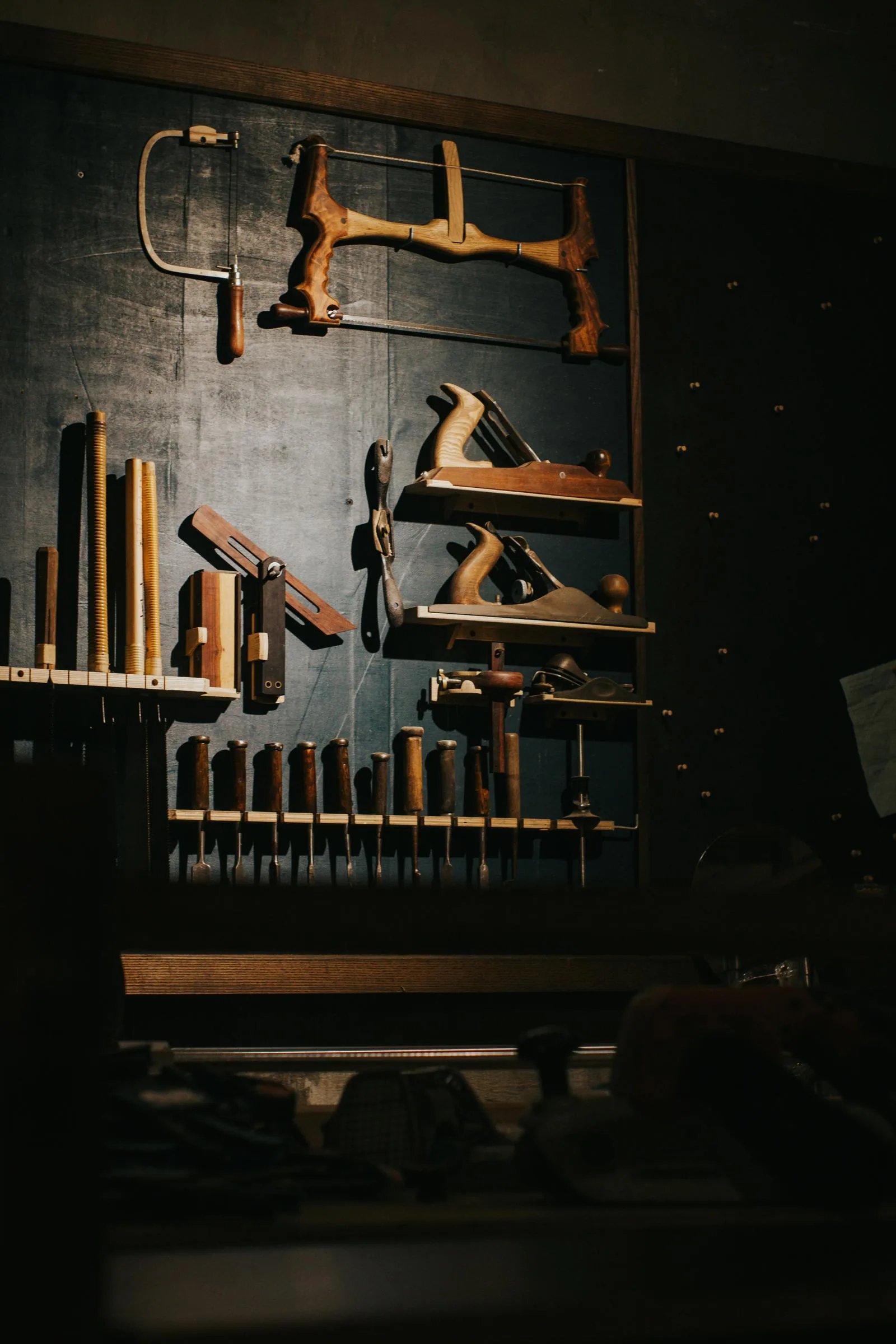 tool wall with saw and planes