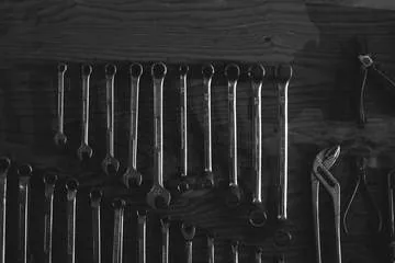 wrenches on dark wood